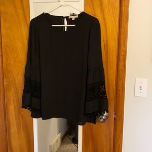 Black blouse with detailed bell sleeves